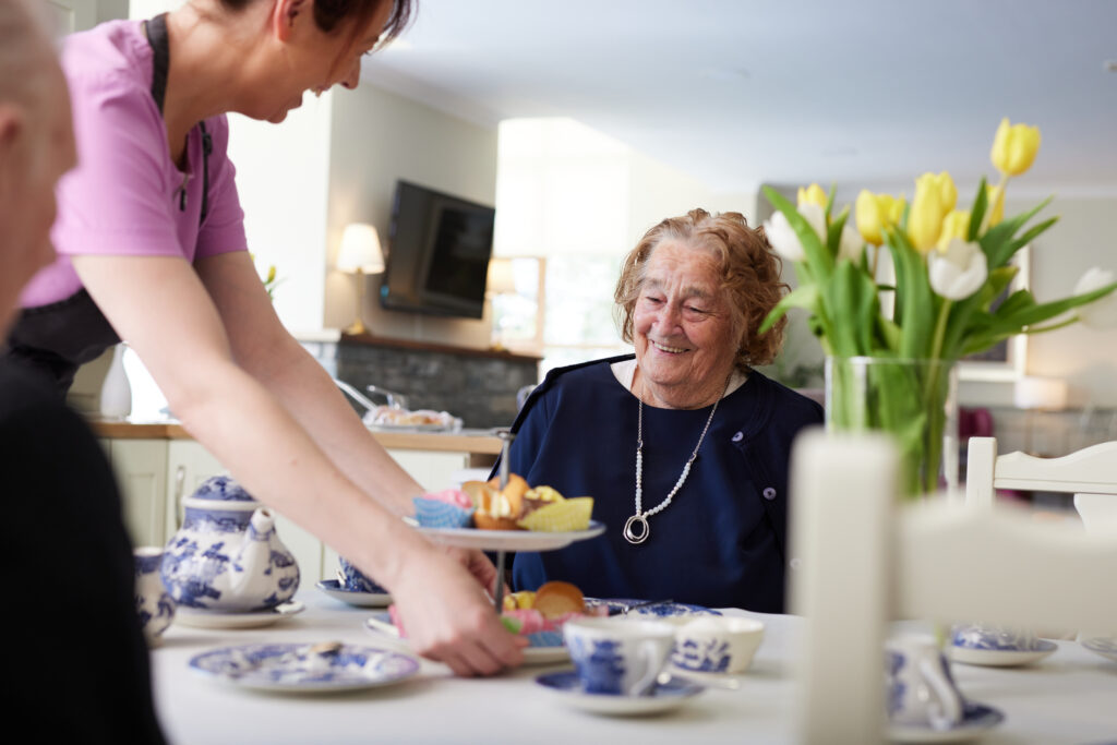 Carlingford Nursing Home resident smiling at afternoon tea