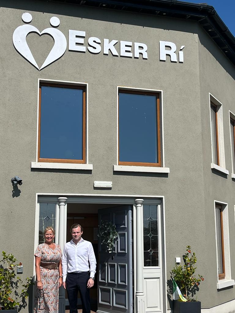 Emmet Prone and Rosetta Herr of Evergreen Care in front of Esker Rí Nursing Home
