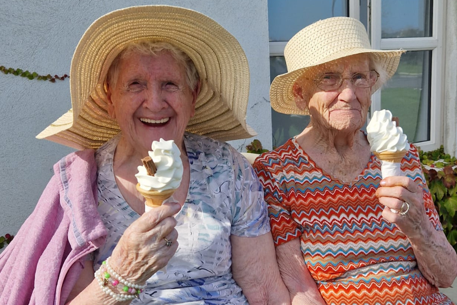 Two residents enjoying ice cream in the sunshine at Castlebridge nursing home, Wexford