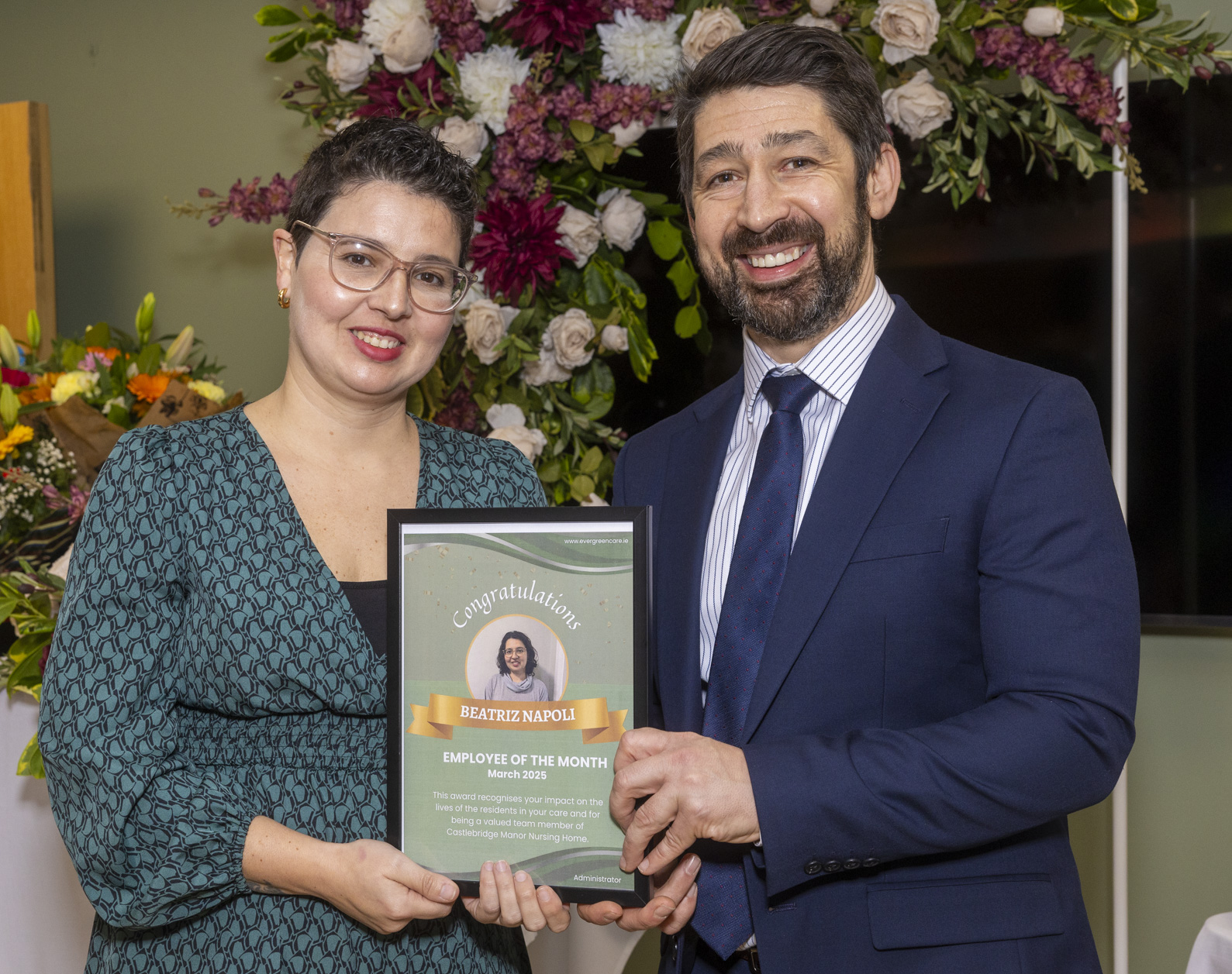 Beatriz Napoli receiving an Evergreen Care employee recognition award