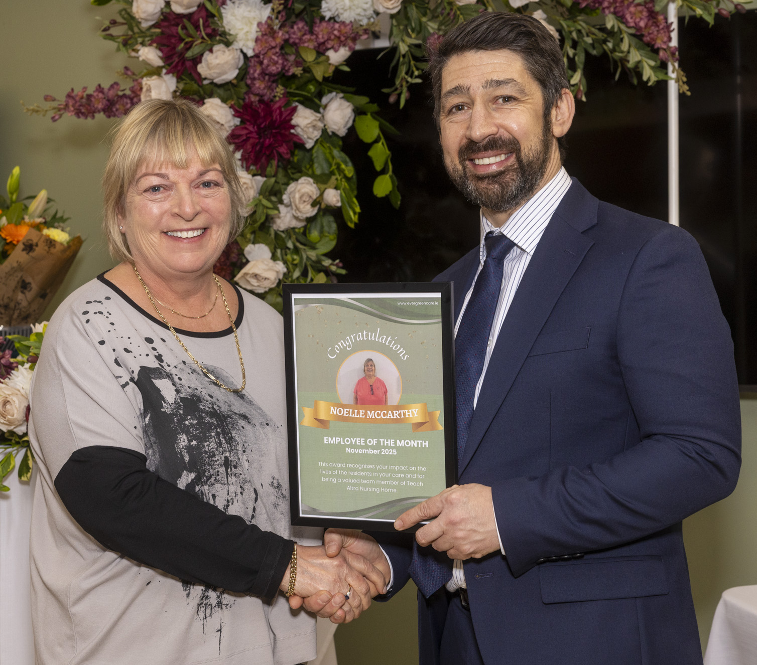 Noelle McCarthy receiving an Evergreen Care employee recognition award